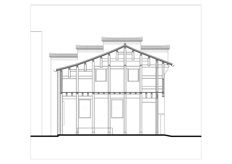 Section drawing revealing a pitched roof structure with timber framing and two-story interior spaces