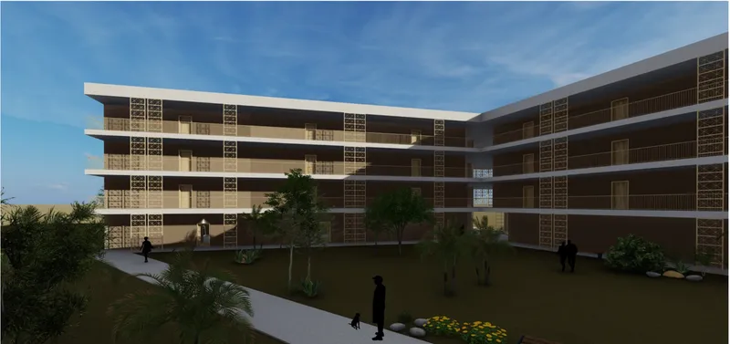 Courtyard at dusk with residents walking along pathways between landscaped beds and the two residential wings