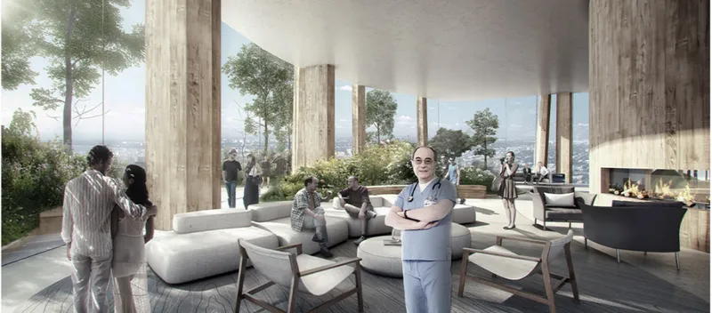 Warm materials, greenery, and panoramic views shape a calming lounge for patients and medical staff.