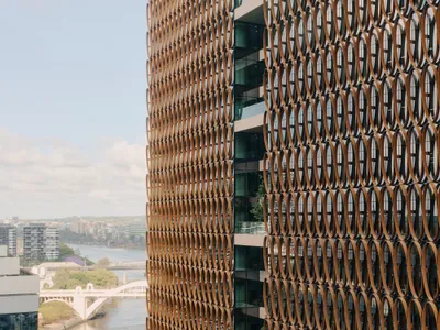 Hassell, REX, and Richards and Spence Wrap a Brisbane Tower in a Climate-Tuned Copper Veil