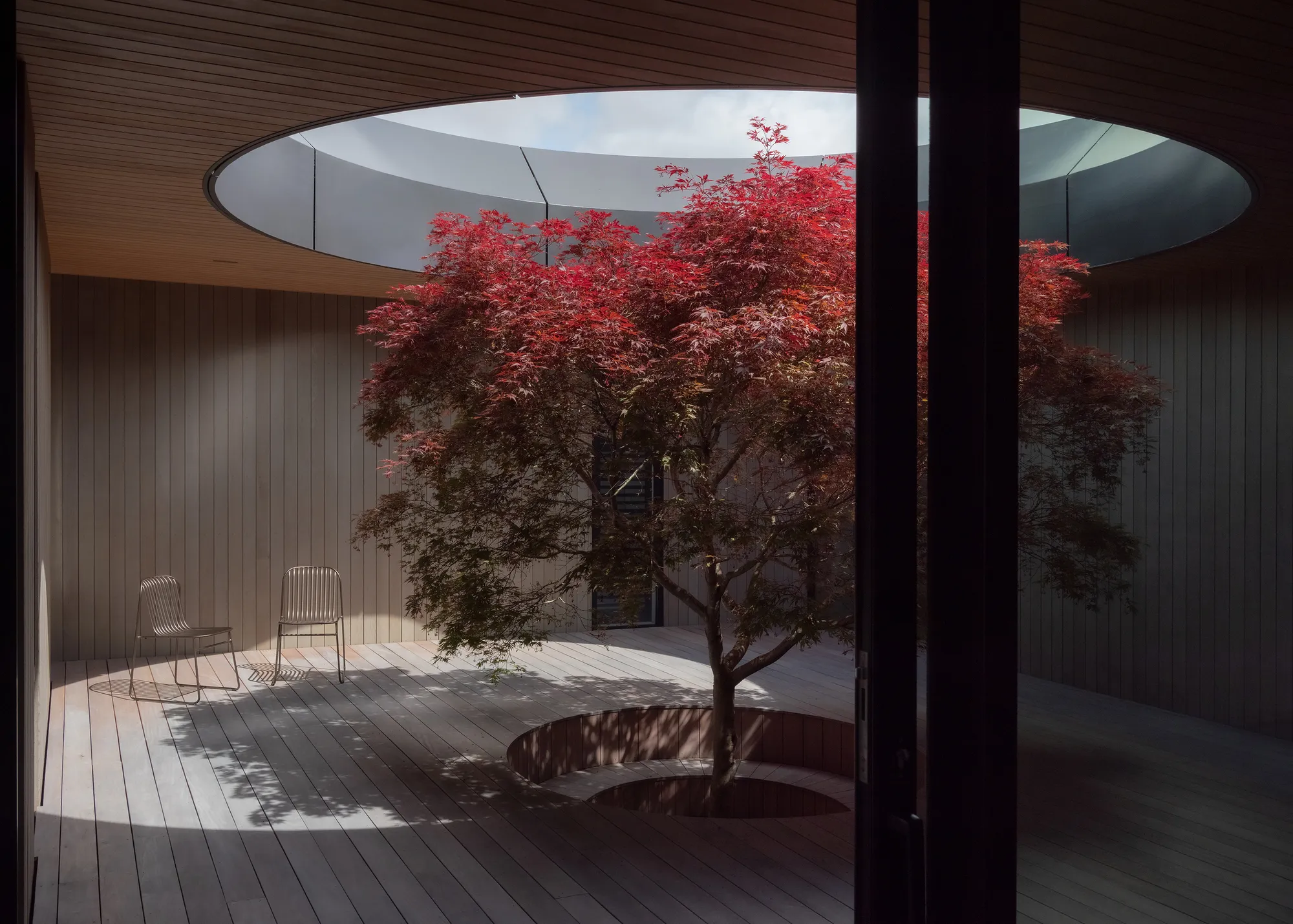 Condon Scott Architects Organizes a Queenstown Home Around a Circular Courtyard Open to the Sky