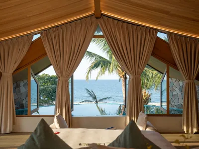 85 Design Shapes a Coastal Villa in Hoi An Around the Arc of a Seagull's Wing