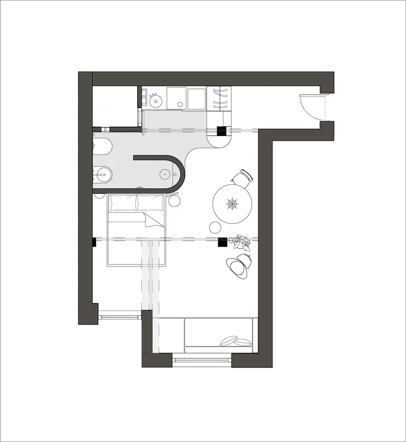 Floor plan showing a compact apartment with bedroom, bathroom, kitchen and living area