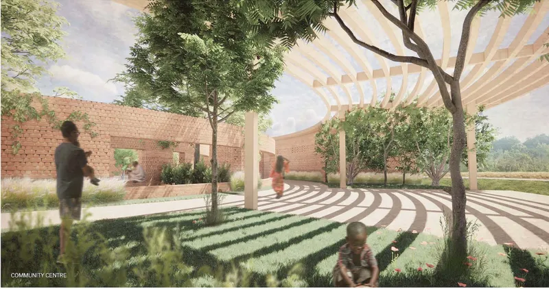 A shaded community centre where landscape, brick walls, and open circulation create a calm gathering space.
