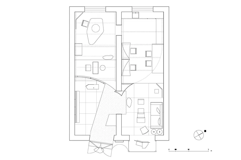 Floor plan drawing showing interconnected rooms with furniture layout and a diagonal courtyard