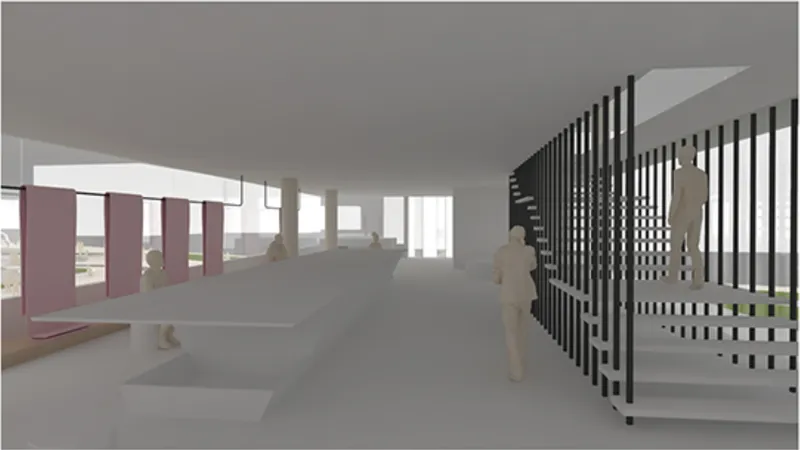 Production studio with fabric panels, worktables, and vertical presentation grids.
