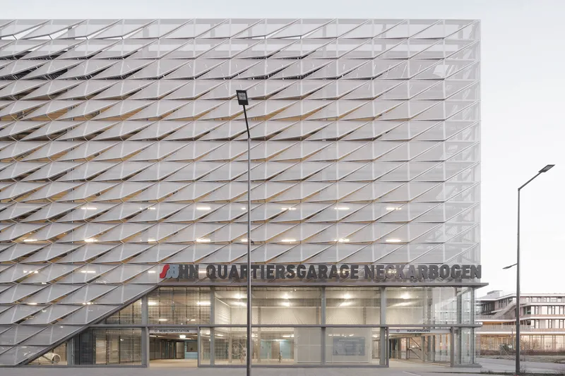 Front elevation showing the perforated metal screen above a fully glazed ground floor entry