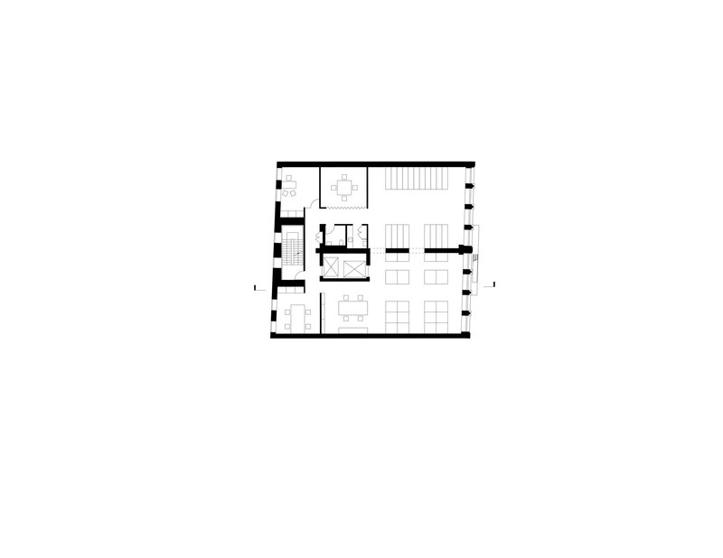 Floor plan drawing showing a flexible workspace with central stair and open seating areas