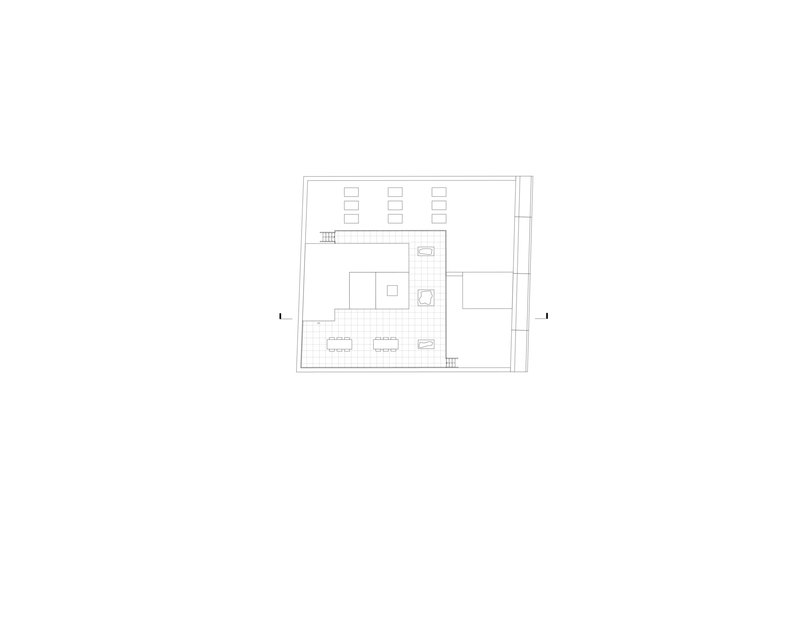 Floor plan drawing showing a rectangular layout with upper level spaces and stairs