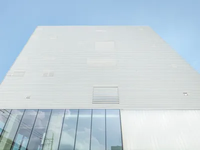 NOTNOT Architects Wraps a Seoul Cultural Hub in a Rhythmic White Louver Skin
