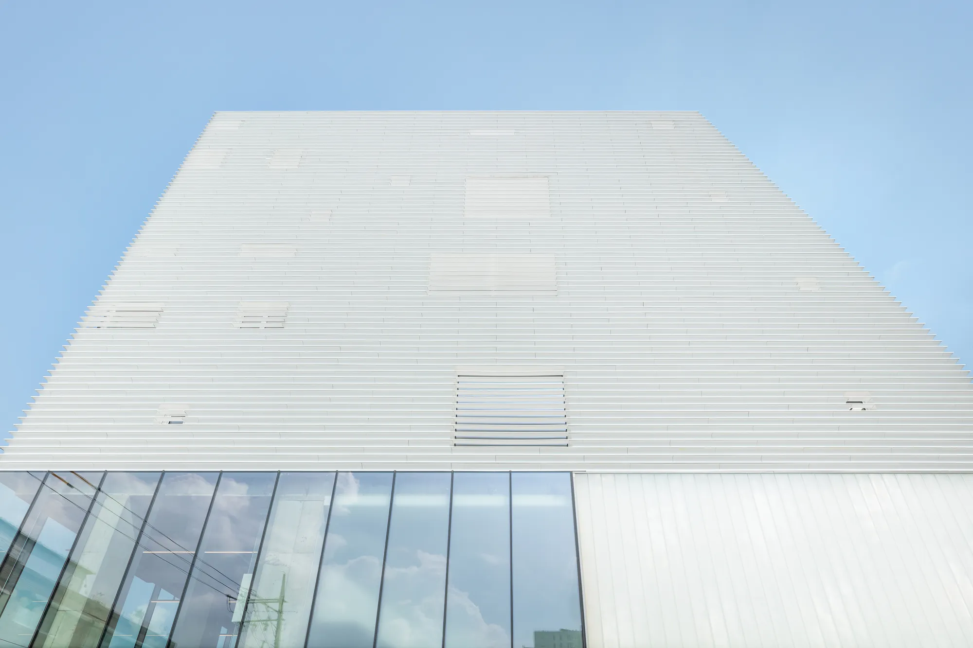 NOTNOT Architects Wraps a Seoul Cultural Hub in a Rhythmic White Louver Skin