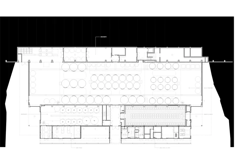 Floor plan drawing showing dining areas with circular table arrangements and a central service core