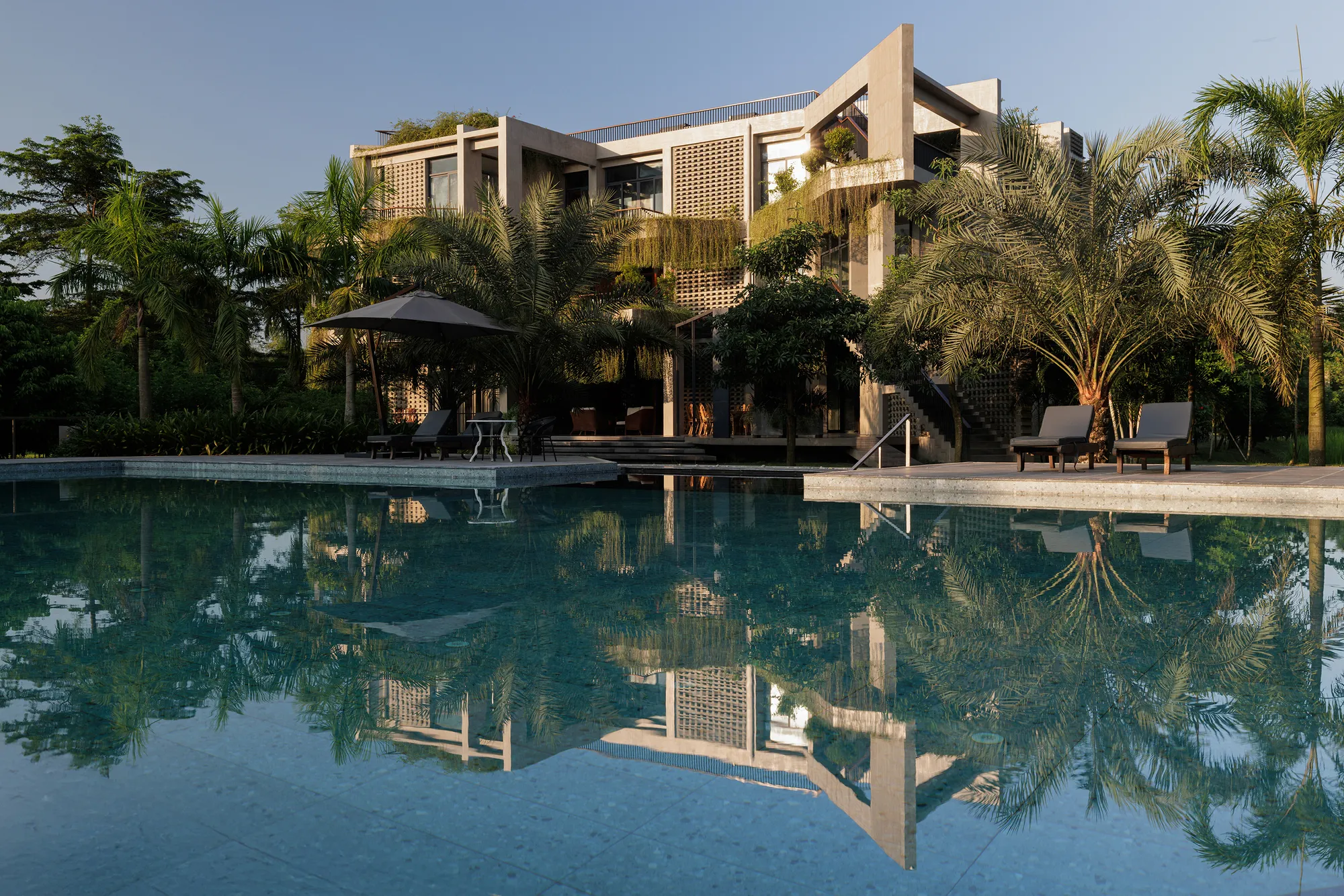 Reincarnation Weaves a Three-Story Retreat into the Green Landscape of Rural Bangladesh