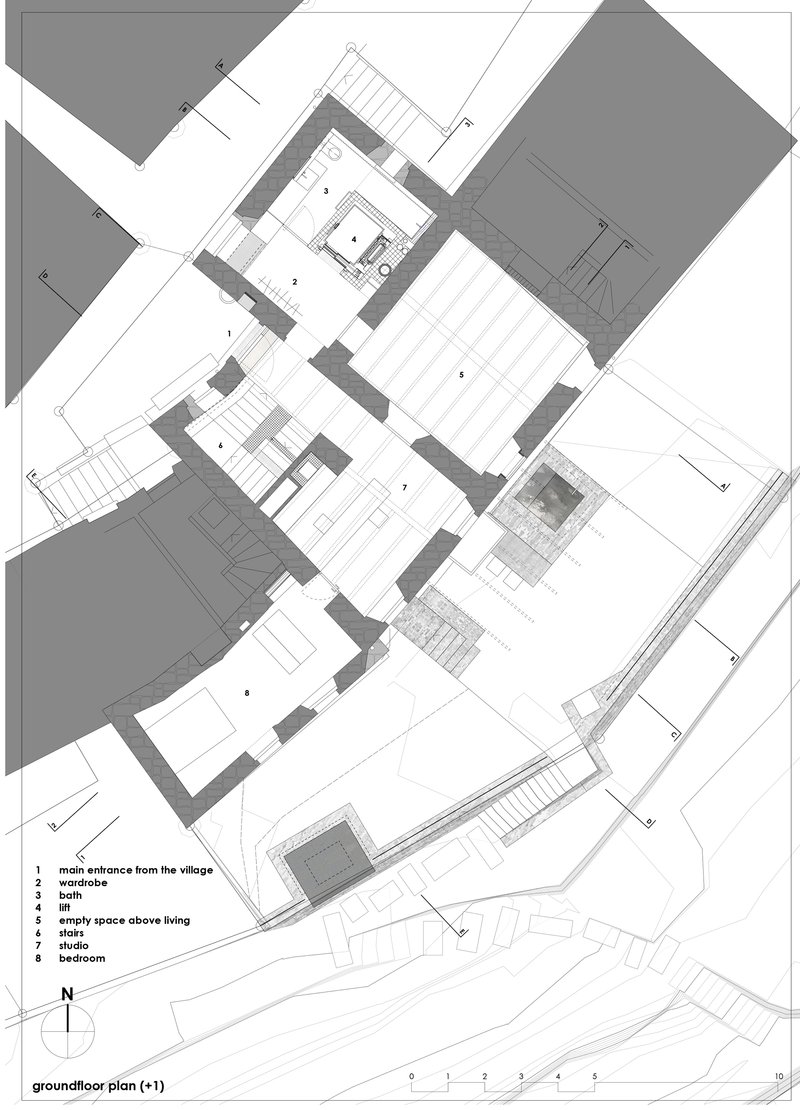 Ground floor plan drawing showing irregular interconnected rooms with stairs and courtyards within thick masonry walls