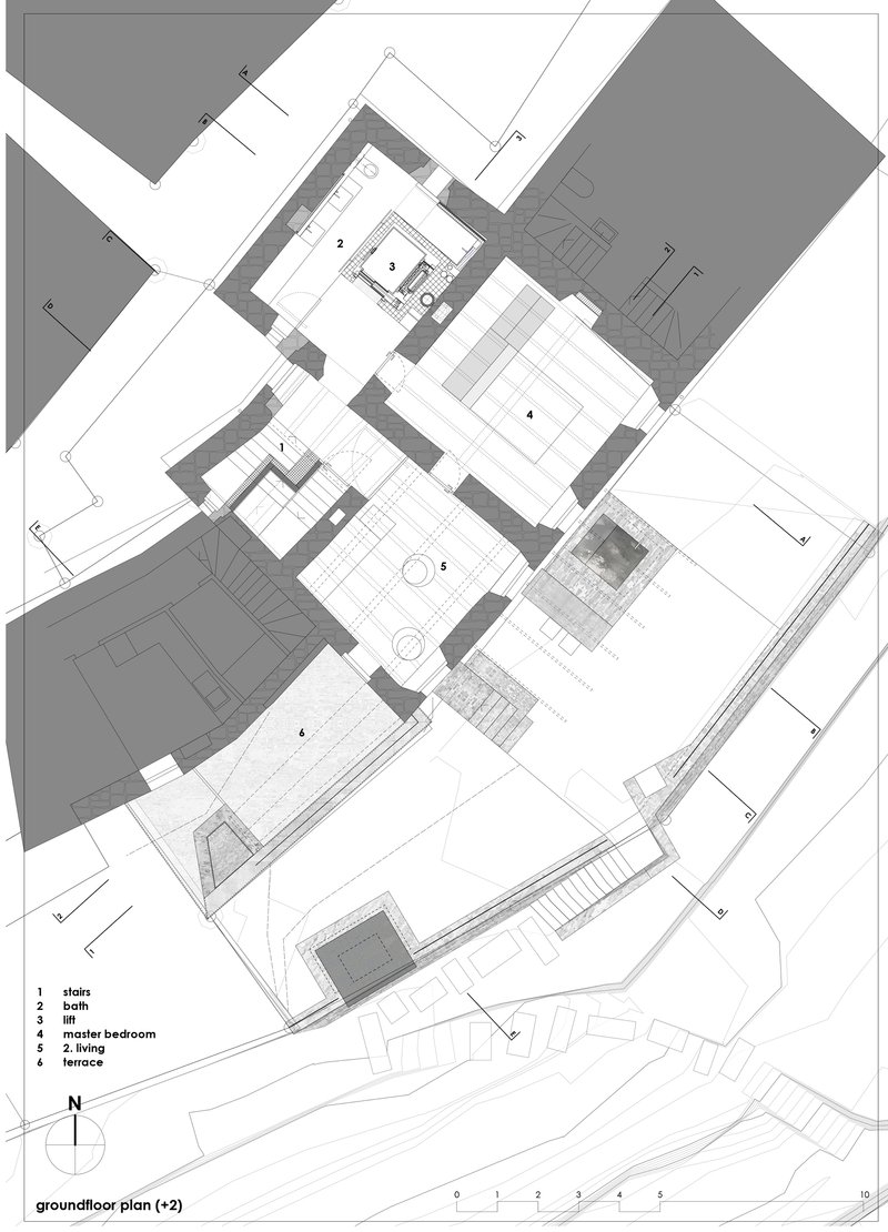 Ground floor plan drawing showing living spaces and terraces arranged around central courtyard with existing structures