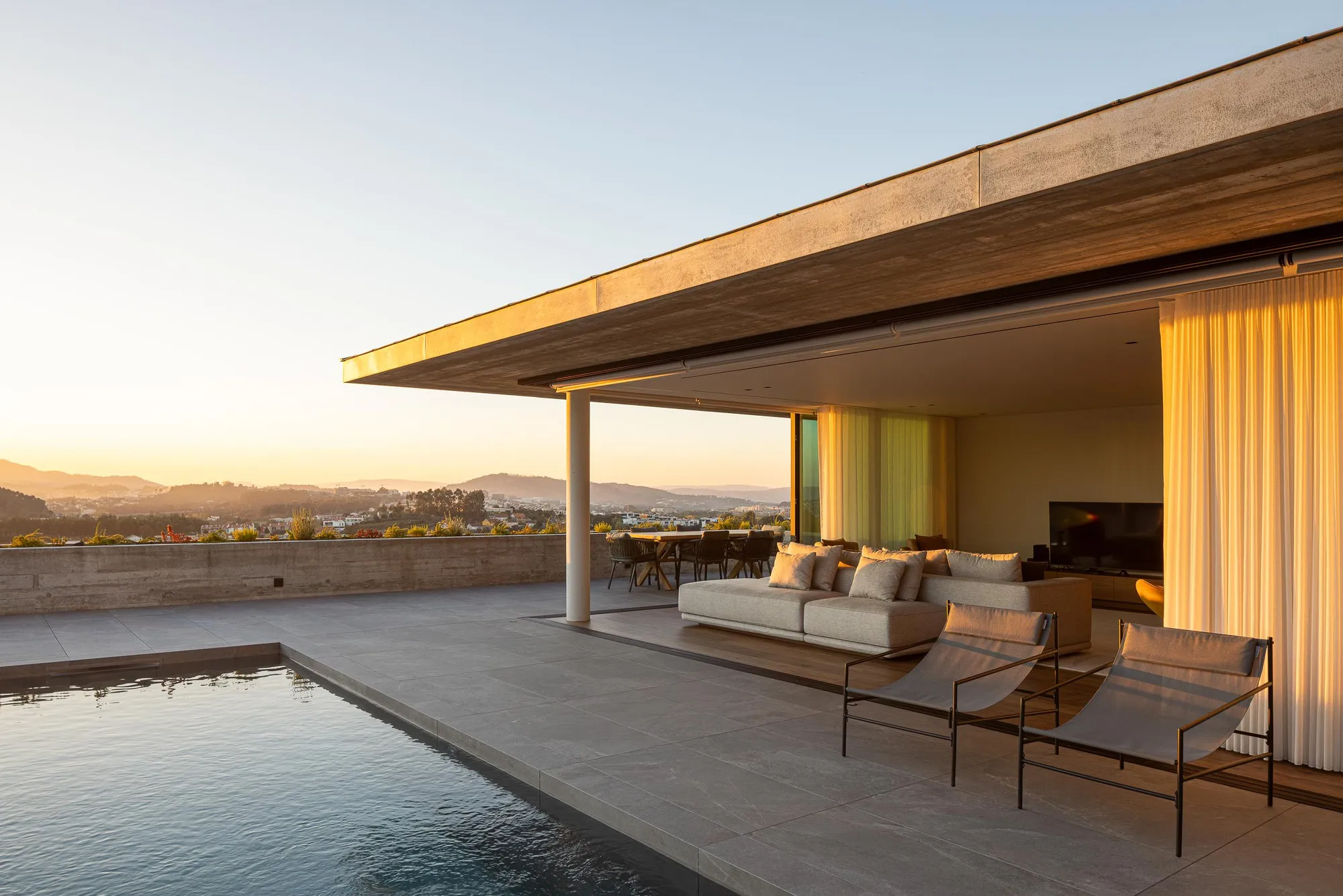 L2C Arquitetura Terraces a Concrete House Down a Steep Braga Hillside