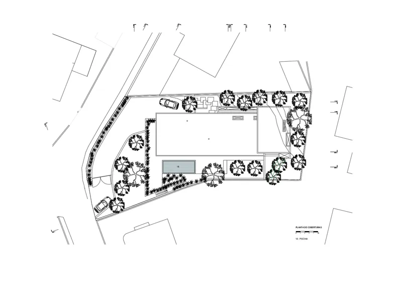 Site plan drawing illustrating the building layout with pool, trees, and vehicular access