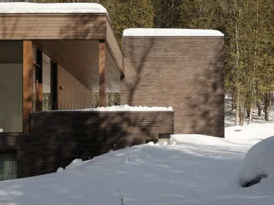 Jérôme Lapierre Architecte Scatters a Family Retreat Across a Quebec Hillside Between Lake and Forest