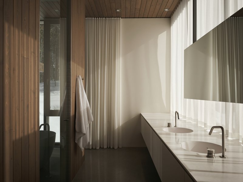 Bathroom with double vanity and vertical timber cladding softly lit through translucent curtains