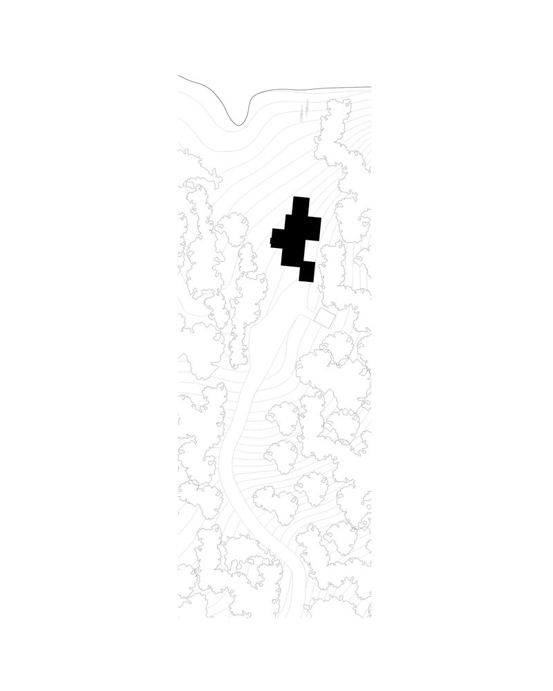 Site plan drawing showing clustered building footprint in black amid contoured topography and scattered vegetation