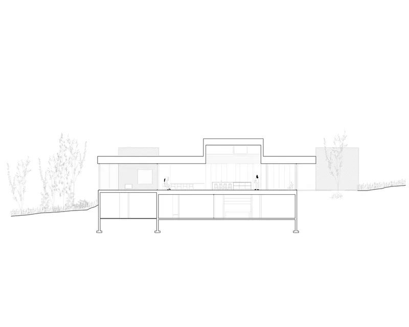 Section drawing revealing split-level interior spaces with raised central volume and elevated deck on columns