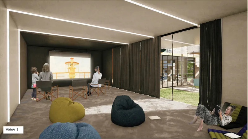 A cinematic storytelling room invites visitors to watch, listen, and experience shared community memories.
