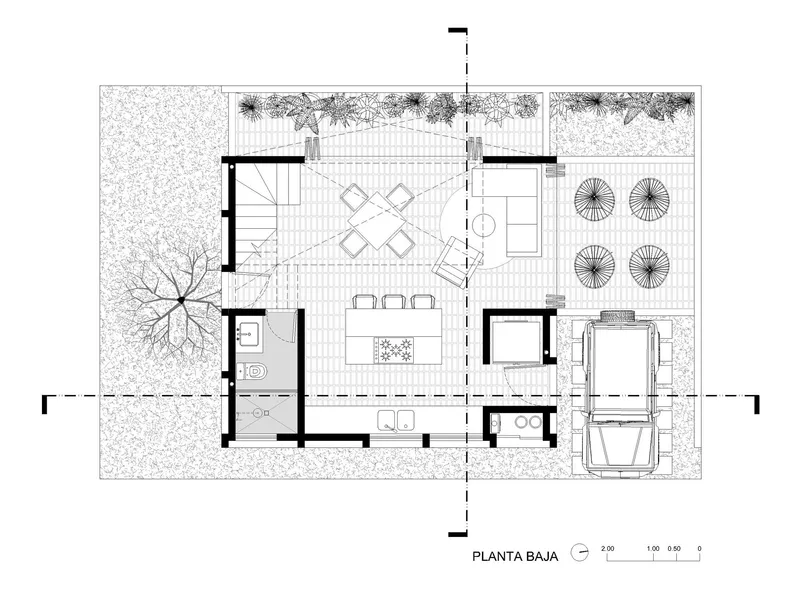 Ground floor plan showing open living and dining spaces with outdoor terrace and carport
