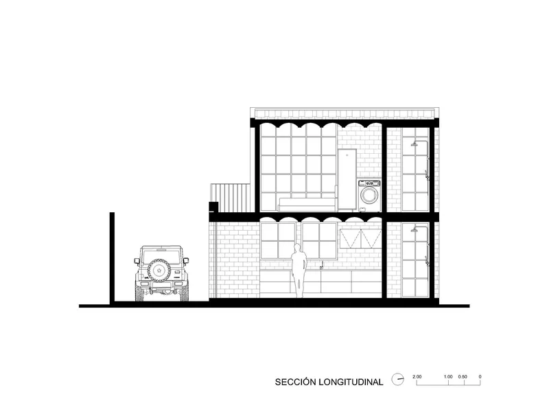 Longitudinal section drawing revealing two-story interior spaces with staircase and parked vehicle