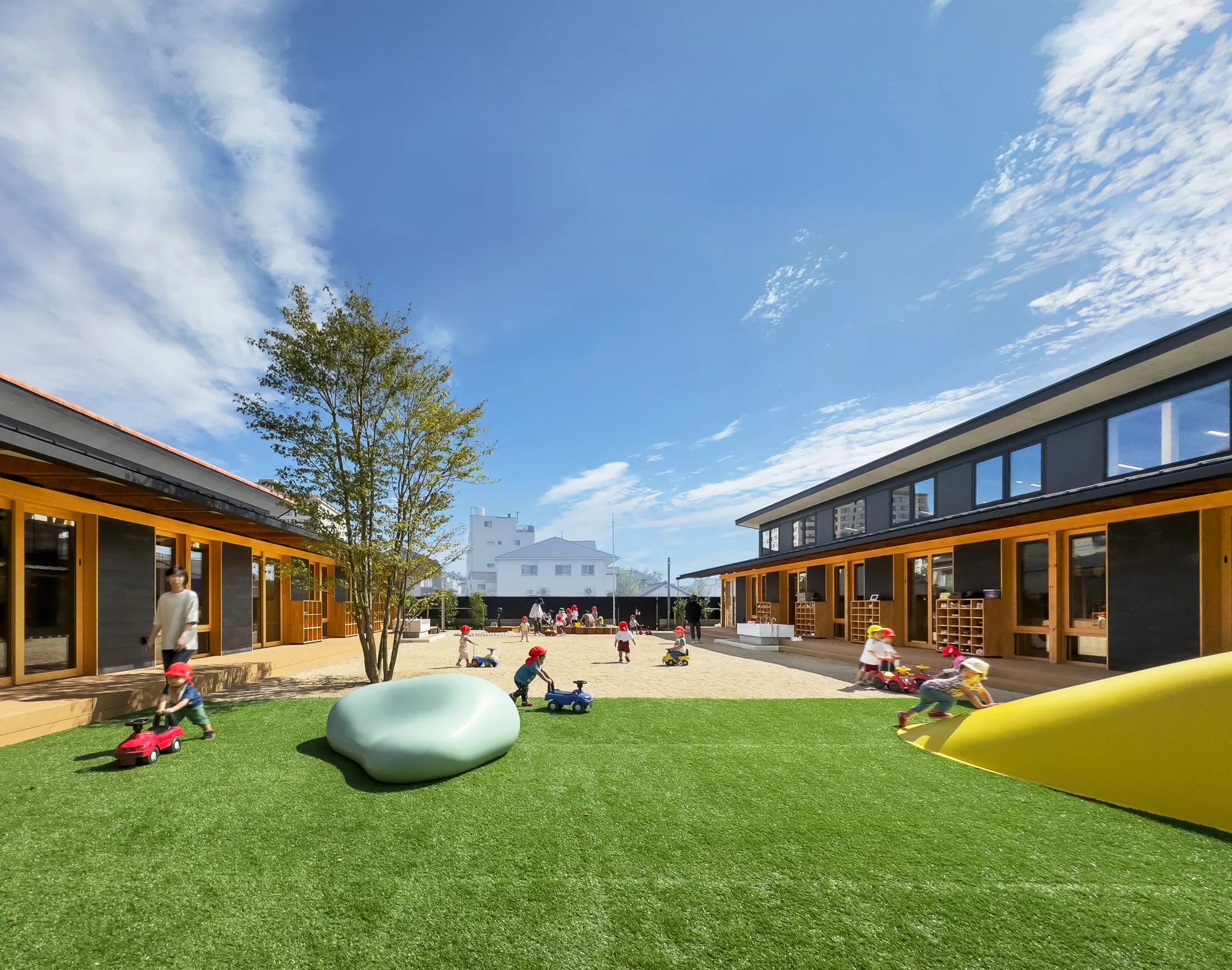 Nikken Sekkei Wraps a Hospital Nursery in Orange Roof Tiles to Honor Kurashiki's Streetscape