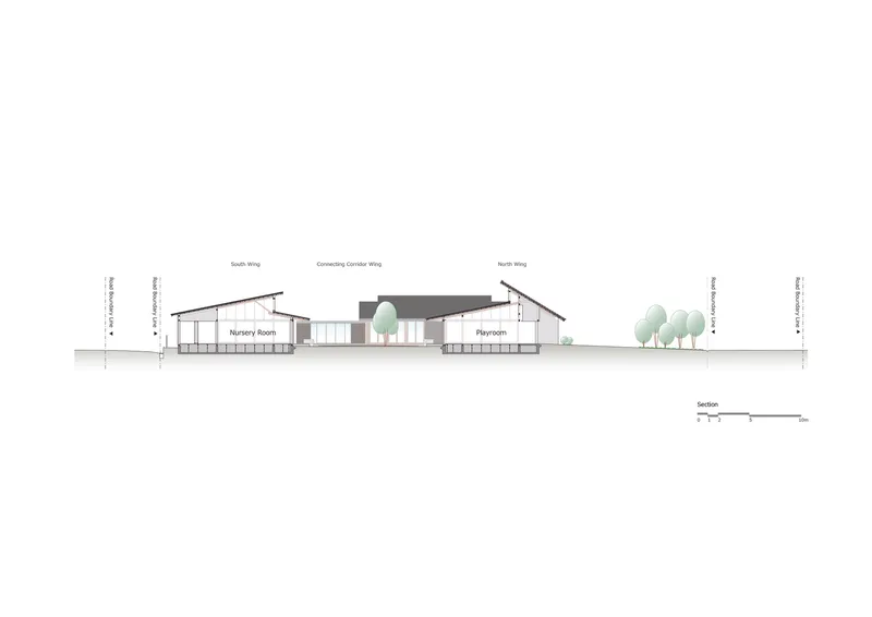 Section drawing revealing nursery room and playroom under angled rooflines with courtyard tree between