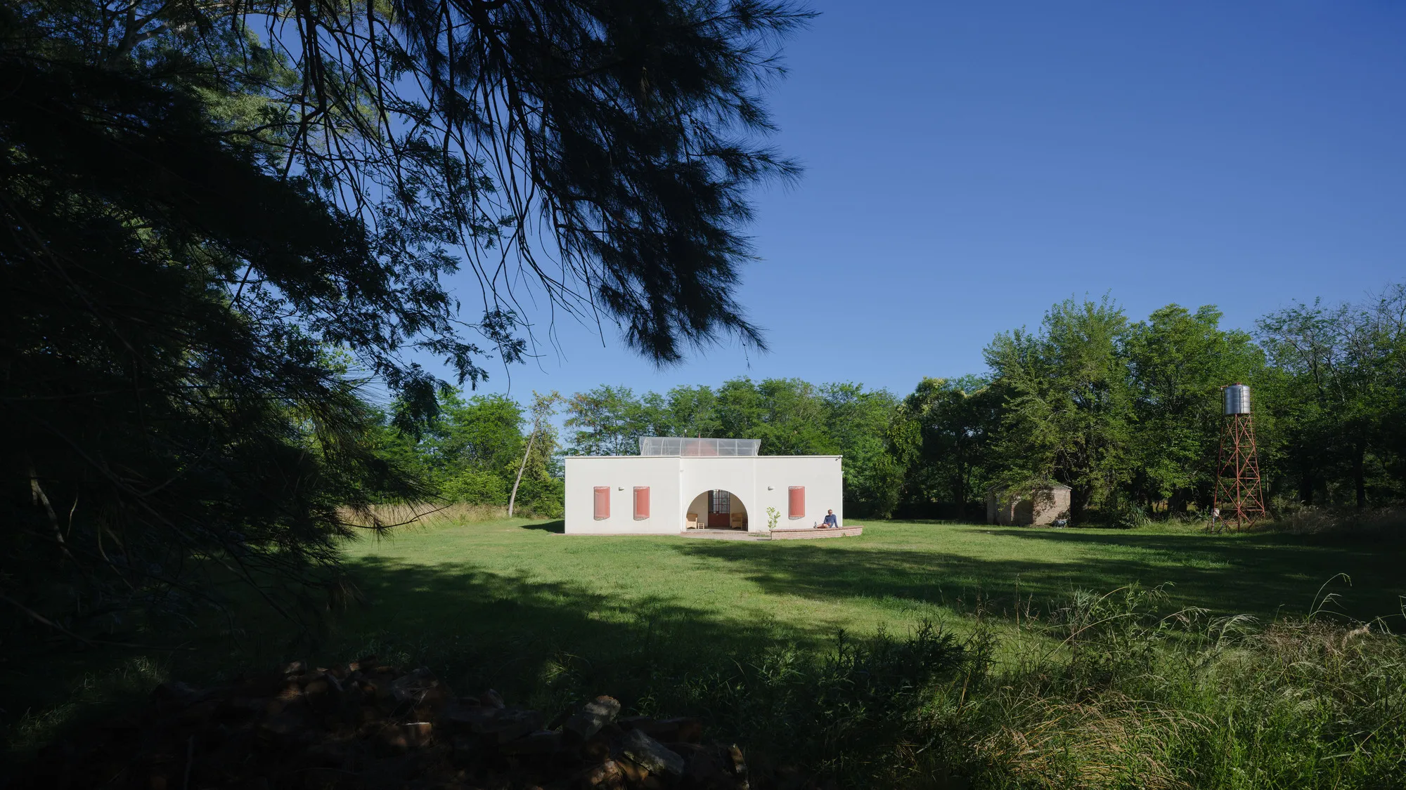IR arquitectura Turns a Forgotten Pampas Farmhouse into a Greenhouse-Centered Guesthouse