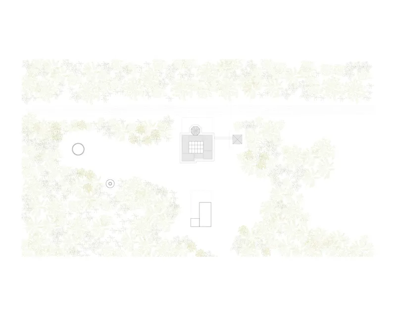 Site plan drawing showing the building footprint within a forested landscape with scattered trees
