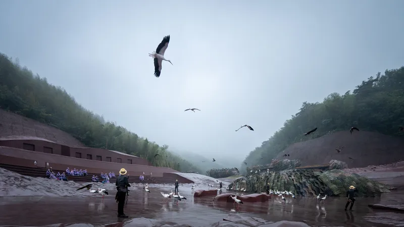 Sloped plaza with visitors and cranes amid flying ibises in heavy morning fog