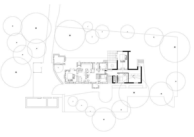 Floor plan drawing showing the linear interior layout with circular tree canopies around the perimeter