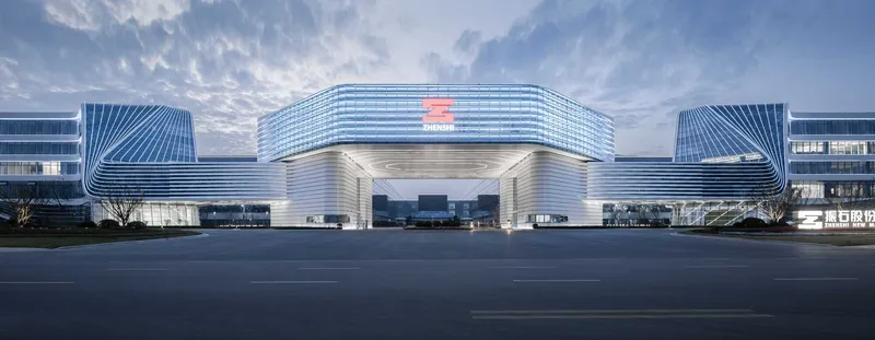 Symmetrical entrance portal with horizontal louvers and illuminated canopy beneath dramatic clouds