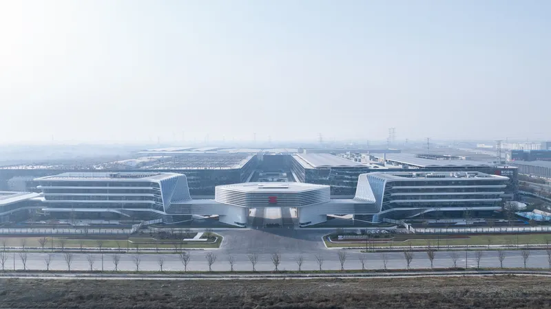 Distant view of the symmetrical campus with horizontal facades and central bridge in hazy conditions