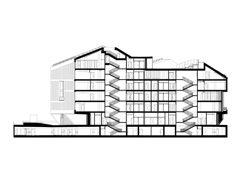 Section drawing revealing the central atrium with zigzag stairs and paired gabled volumes