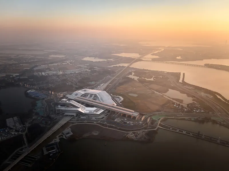 Aerial view of the terminal building and adjacent waterways at sunrise