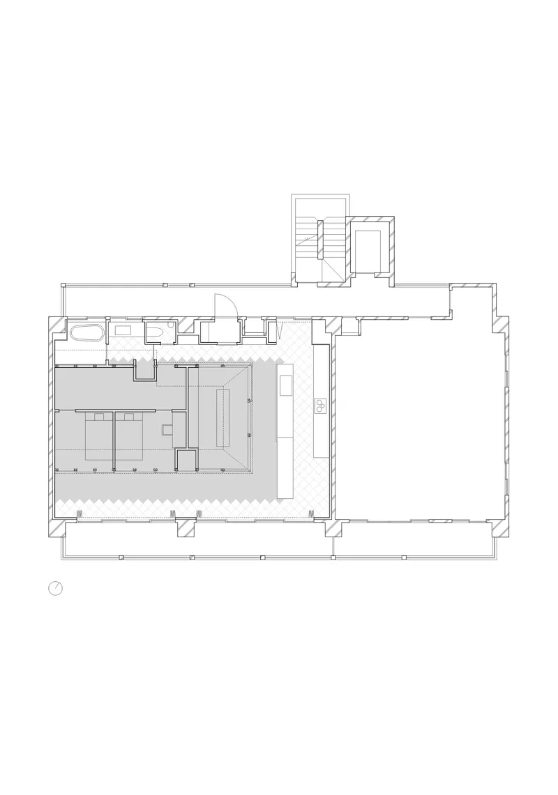 Floor plan drawing showing kitchen area with island and open dining space adjacent to entry hall