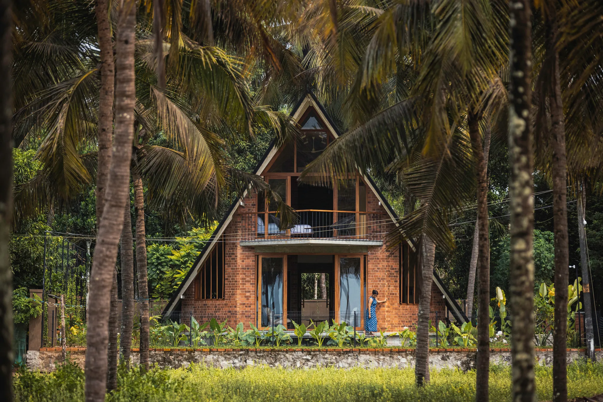 Bhoomija Creations Folds a 1,000-Square-Foot Cottage into an A-Frame Shell on Kerala's Coast