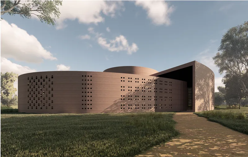 A shaded entrance frames the journey into Peace Chapel’s sacred and community-centered interior.