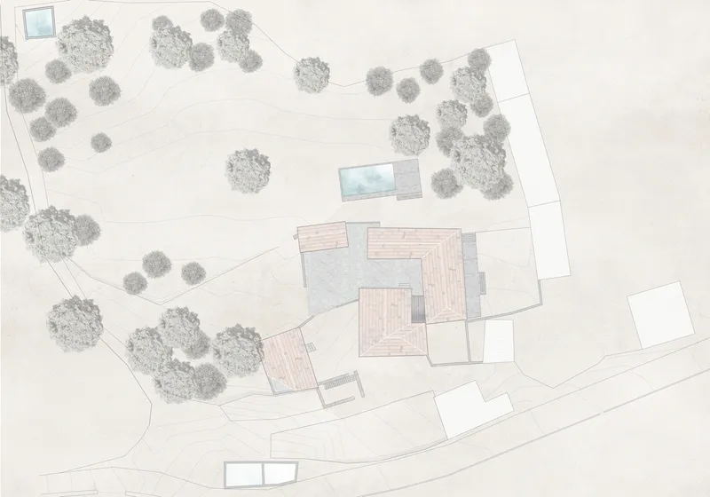 Site plan drawing showing building footprints with tiled roofs surrounded by trees and pathways