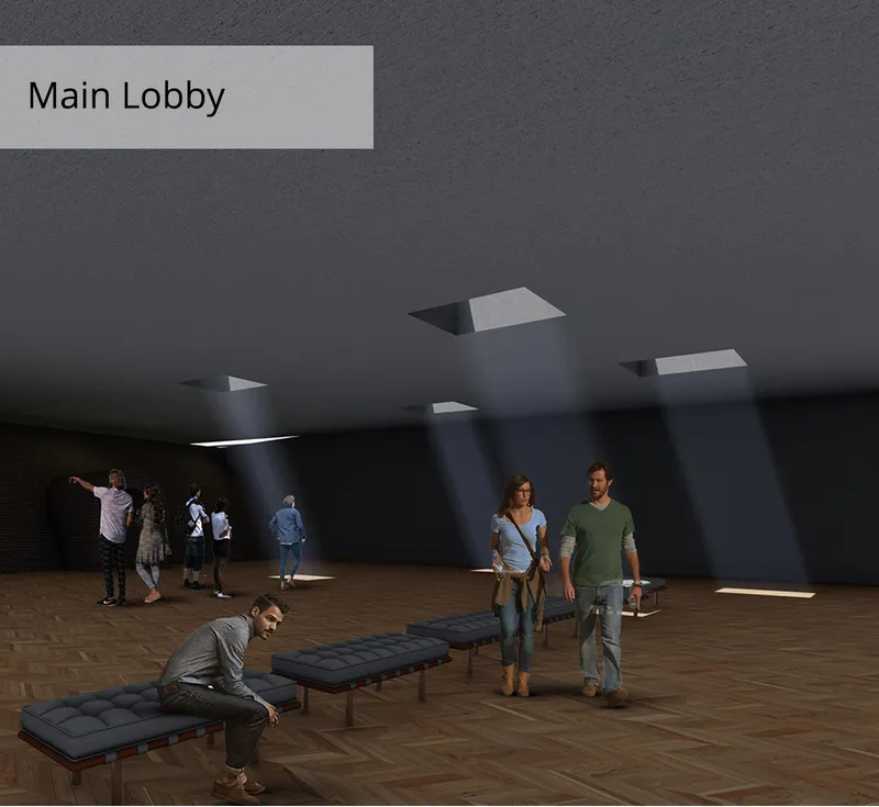 A dark, atmospheric lobby illuminated by controlled skylights, creating a dramatic transition into the winery.