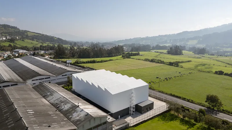 TEC Taller EC Stacks a Red Steel Office Inside a 23-Meter-Tall Andean Warehouse