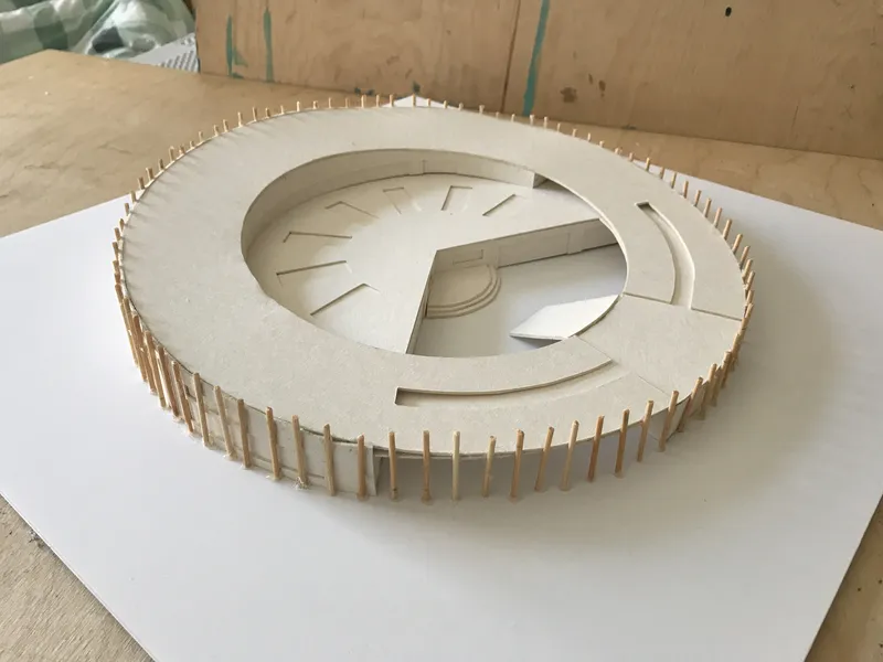 Circular kindergarten model showing the walkable sloped roof and open central courtyard.