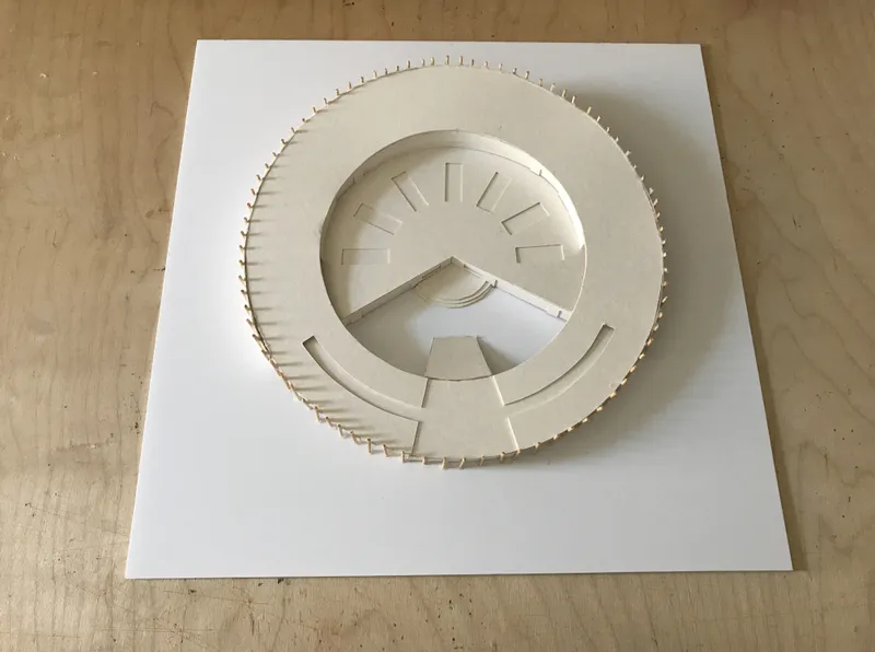 Top view of the kindergarten model highlighting its ring-shaped plan and playful roof access.