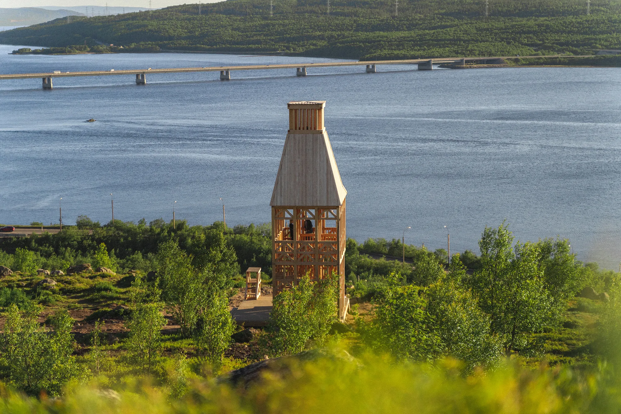 Evgeny Makarenko Builds a Timber Lighthouse on a Kola Bay Hillside with Almost No Metal Fasteners