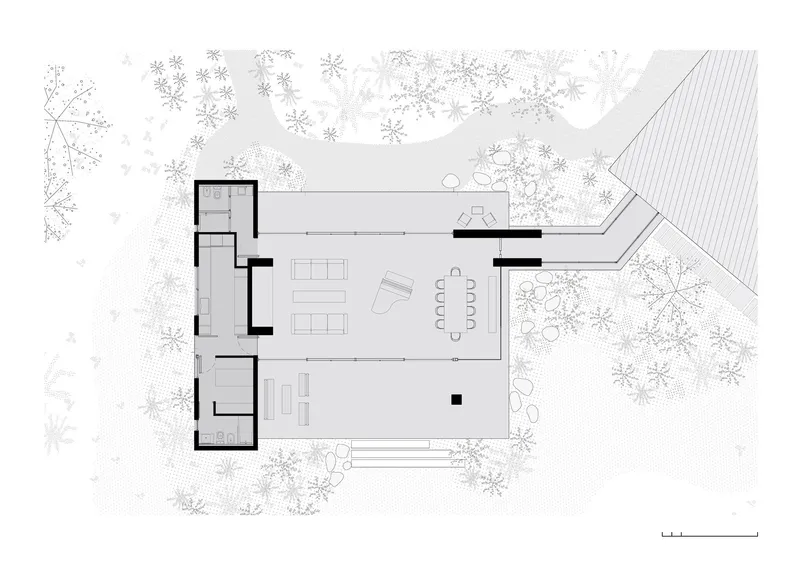 Floor plan drawing showing an open living and dining space with glazed walls opening to landscape