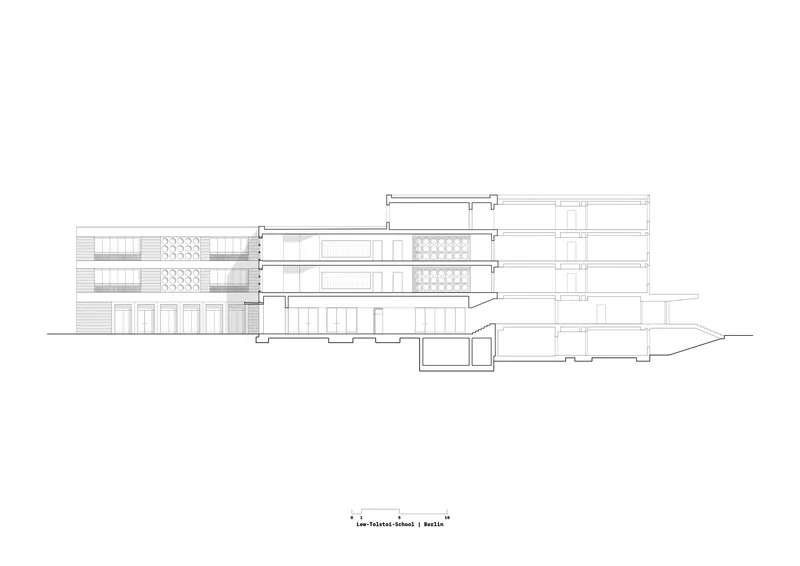 Section drawing showing the layered interior spaces and underground levels of the structure