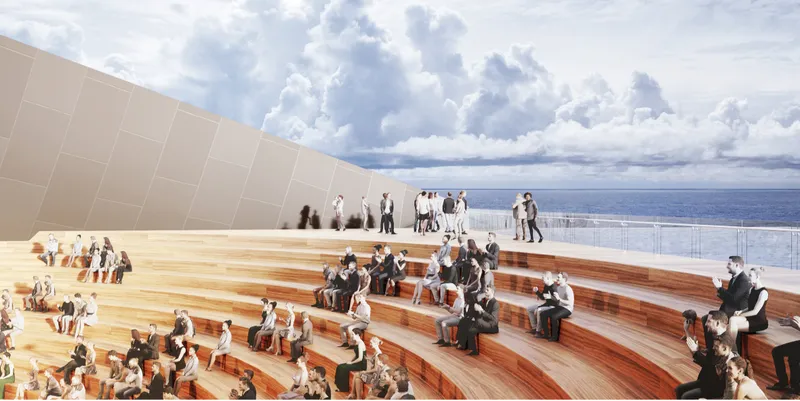 Open-air amphitheater creates a performance space directly connected to the Baltic Sea